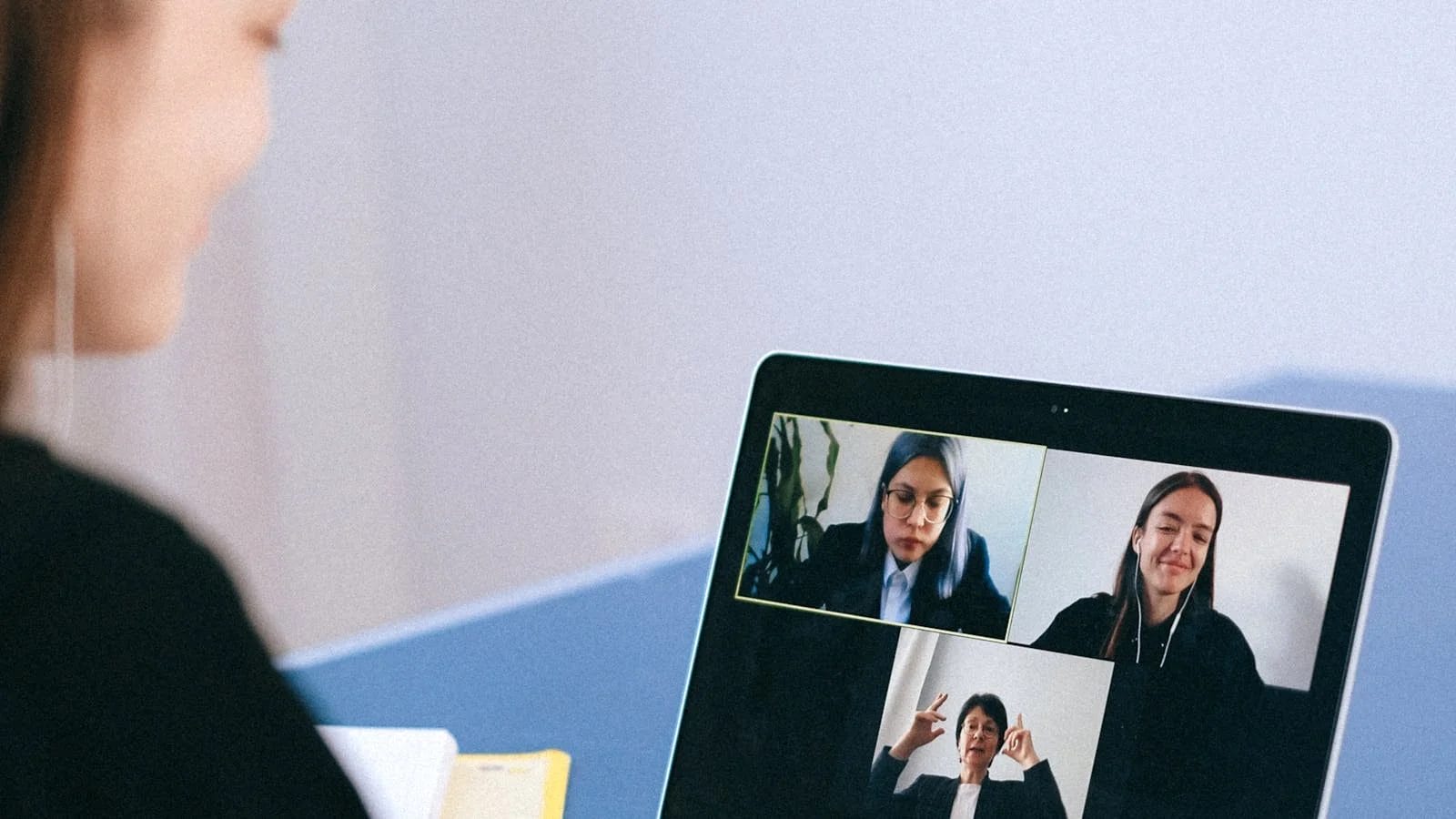 Woman participating in an online community meeting, representing safe moderated digital spaces